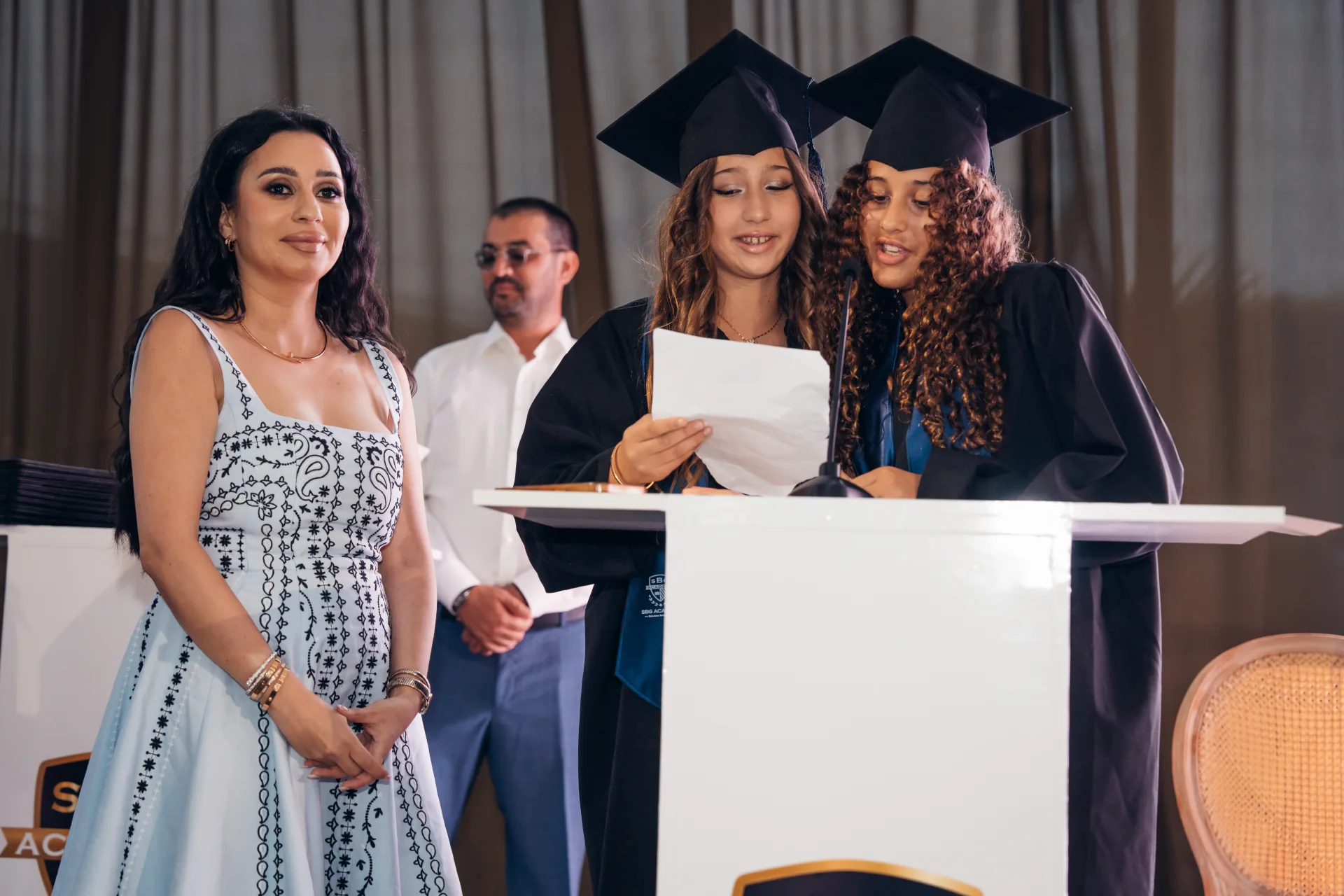SBG Academy graduates delivering a speech at their graduation ceremony